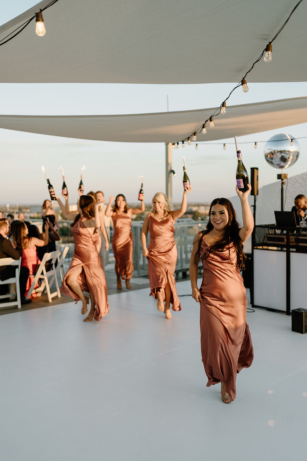 Bridesmaids entrance with champagne